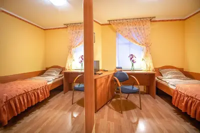 Łóżko lub łóżka w pokoju w obiekcie Willa Alexander