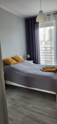 Łóżko lub łóżka w pokoju w obiekcie Apartament Przejazdowa