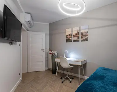 Telewizja i/lub zestaw kina domowego w obiekcie B&W Luxurious Apartment in the center of Wroclaw