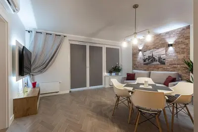 Telewizja i/lub zestaw kina domowego w obiekcie B&W Luxurious Apartment in the center of Wroclaw