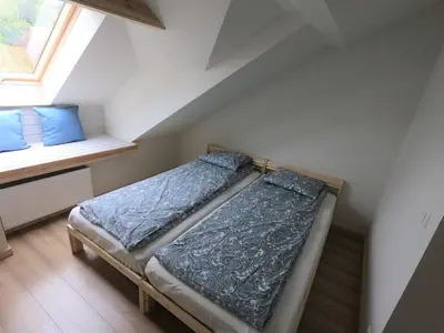 Łóżko lub łóżka w pokoju w obiekcie Apartament Sady przy Ślęży