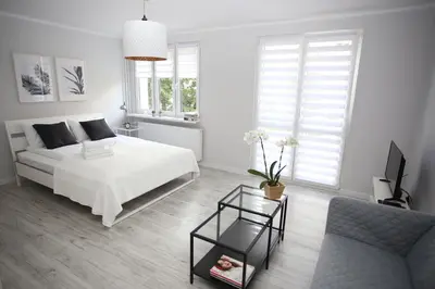 Łóżko lub łóżka w pokoju w obiekcie APARTAMENT SŁOBÓDZKIEGO 7