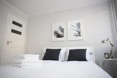Łóżko lub łóżka w pokoju w obiekcie APARTAMENT SŁOBÓDZKIEGO 7