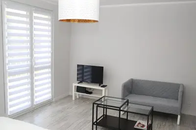 Telewizja i/lub zestaw kina domowego w obiekcie APARTAMENT SŁOBÓDZKIEGO 7