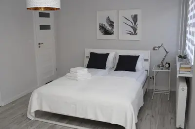 Łóżko lub łóżka w pokoju w obiekcie APARTAMENT SŁOBÓDZKIEGO 7