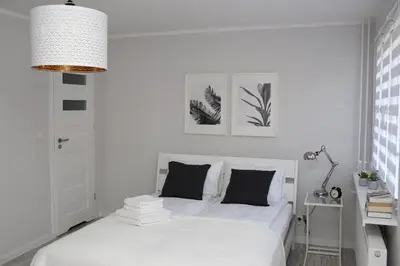 Łóżko lub łóżka w pokoju w obiekcie APARTAMENT SŁOBÓDZKIEGO 7