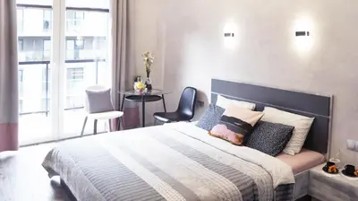 Łóżko lub łóżka w pokoju w obiekcie Art Apartments II