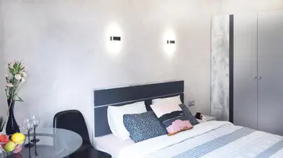 Łóżko lub łóżka w pokoju w obiekcie Art Apartments II