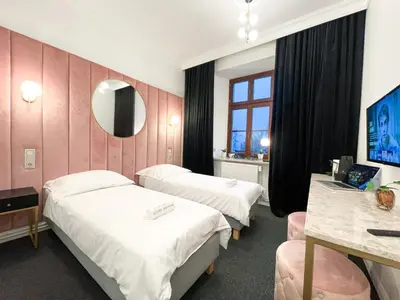 Łóżko lub łóżka w pokoju w obiekcie Apartamenty Stary Browar Oleśnica
