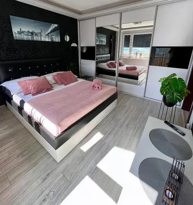 Łóżko lub łóżka w pokoju w obiekcie Spółdzielcza 22 Apartament Sky Line
