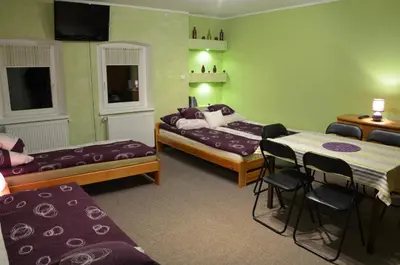 Łóżko lub łóżka w pokoju w obiekcie Nad Młynówką