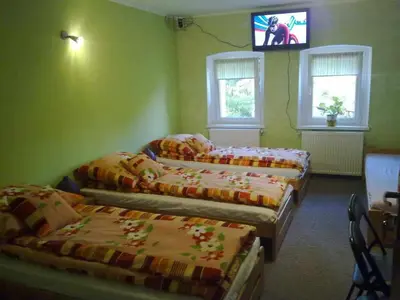 Łóżko lub łóżka w pokoju w obiekcie Nad Młynówką