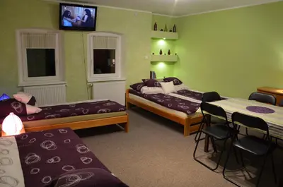 Łóżko lub łóżka w pokoju w obiekcie Nad Młynówką