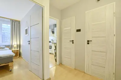 Łóżko lub łóżka w pokoju w obiekcie Apartament Dzień Dobry 2