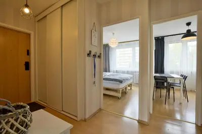 Łóżko lub łóżka w pokoju w obiekcie Apartament Dzień Dobry 2