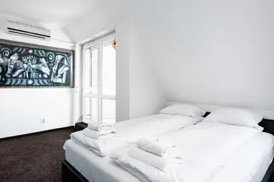 Łóżko lub łóżka w pokoju w obiekcie Apartments Wrocław Manganowa by Noclegi Renters