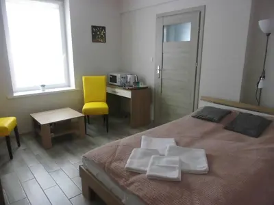 Łóżko lub łóżka w pokoju w obiekcie Bezowy pokój