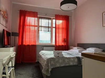 Łóżko lub łóżka w pokoju w obiekcie VULTOR Apartments