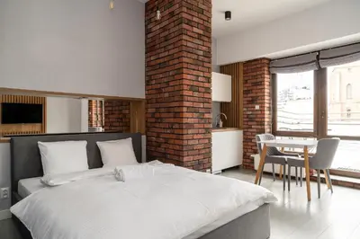 Łóżko lub łóżka w pokoju w obiekcie RentPlanet - Studio Ruska
