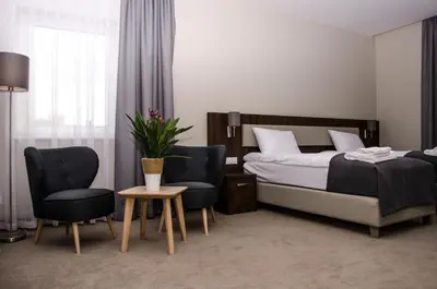 Łóżko lub łóżka w pokoju w obiekcie ART Pensjonat