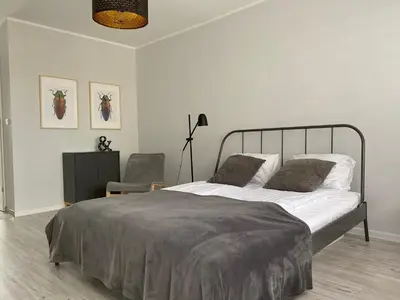 Łóżko lub łóżka w pokoju w obiekcie APARTAMENT KILIŃSKIEGO 9