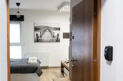 Łóżko lub łóżka w pokoju w obiekcie Tymon Apartament przy deptaku