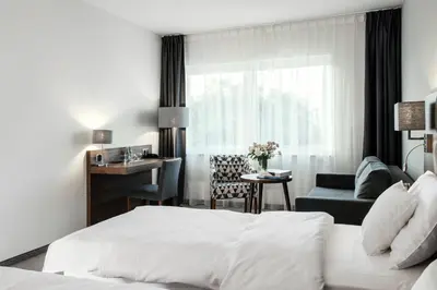 Łóżko lub łóżka w pokoju w obiekcie DB Hotel Wrocław