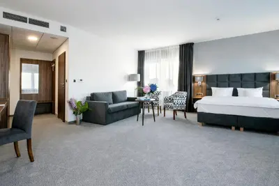 Łóżko lub łóżka w pokoju w obiekcie DB Hotel Wrocław