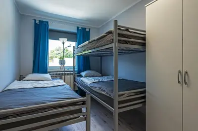 Łóżko lub łóżka w pokoju w obiekcie Pokoje nad Odrą Wały