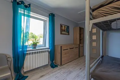 Łóżko lub łóżka w pokoju w obiekcie Pokoje nad Odrą Wały