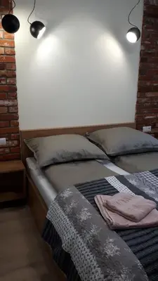 Łóżko lub łóżka w pokoju w obiekcie Apartamenty przy Parku Szwedzkim