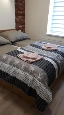 Łóżko lub łóżka w pokoju w obiekcie Apartamenty przy Parku Szwedzkim