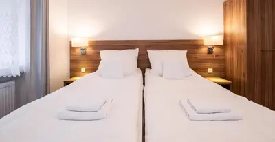 Łóżko lub łóżka w pokoju w obiekcie Apartamenty ZYGFRYD 28C/3/2