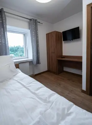 Łóżko lub łóżka w pokoju w obiekcie Apartamenty ZYGFRYD 28C/3/2