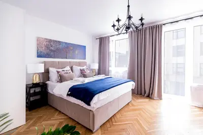 Łóżko lub łóżka w pokoju w obiekcie Apartament Oławska