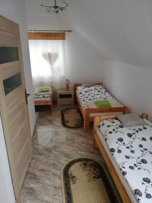 Łóżko lub łóżka w pokoju w obiekcie Potok 5