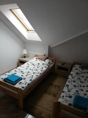 Łóżko lub łóżka w pokoju w obiekcie Potok 5