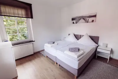 Łóżko lub łóżka w pokoju w obiekcie LEŚNE ZACISZE