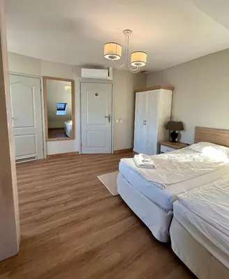 Łóżko lub łóżka w pokoju w obiekcie Hotel Nad Stawem