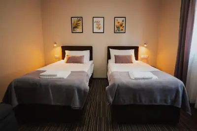 Łóżko lub łóżka w pokoju w obiekcie Villa Paula