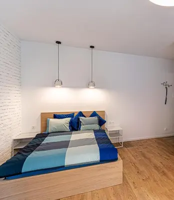 Łóżko lub łóżka w pokoju w obiekcie Apartament Jagiełły (wroc4night)