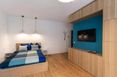 Łóżko lub łóżka w pokoju w obiekcie Apartament Jagiełły (wroc4night)