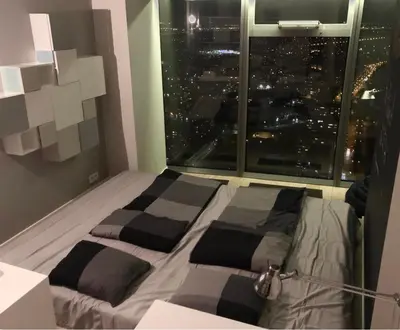 Łóżko lub łóżka w pokoju w obiekcie Vantage Point Apartament Sky Tower