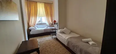Łóżko lub łóżka w pokoju w obiekcie APARTAMENT ADA