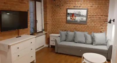 Telewizja i/lub zestaw kina domowego w obiekcie Apartament Uroczy Zakątek