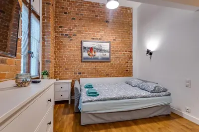 Łóżko lub łóżka w pokoju w obiekcie Apartament Uroczy Zakątek
