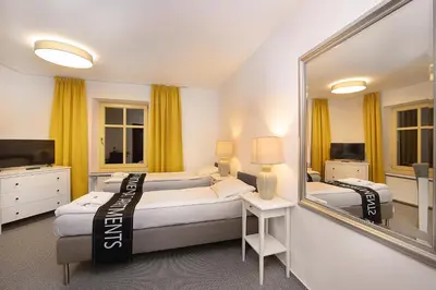 Łóżko lub łóżka w pokoju w obiekcie CIENISTA 7 APARTMENTS
