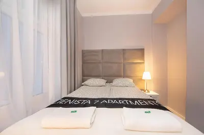 Łóżko lub łóżka w pokoju w obiekcie CIENISTA 7 APARTMENTS
