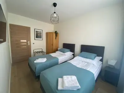 Łóżko lub łóżka w pokoju w obiekcie Wrocław Premium Apartment 4You