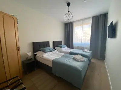 Łóżko lub łóżka w pokoju w obiekcie Wrocław Premium Apartment 4You